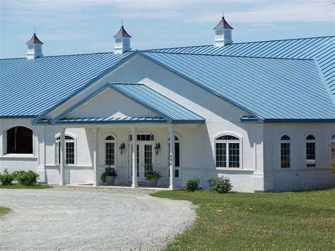 blue house with white metal roof|houses with blue roofs pictures.